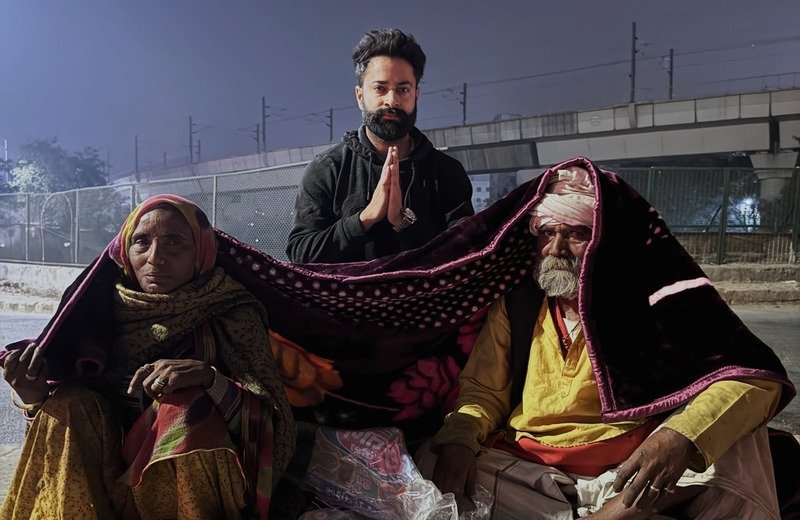 Distributing heavy warm winter blankets and emergency relief to homeless families